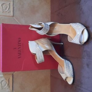 Studded white heels by Valentino